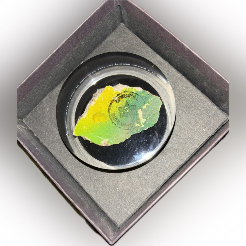 1989 Berlin Wall Remnant encased in Lucite-Paper weight. From Time Warner
